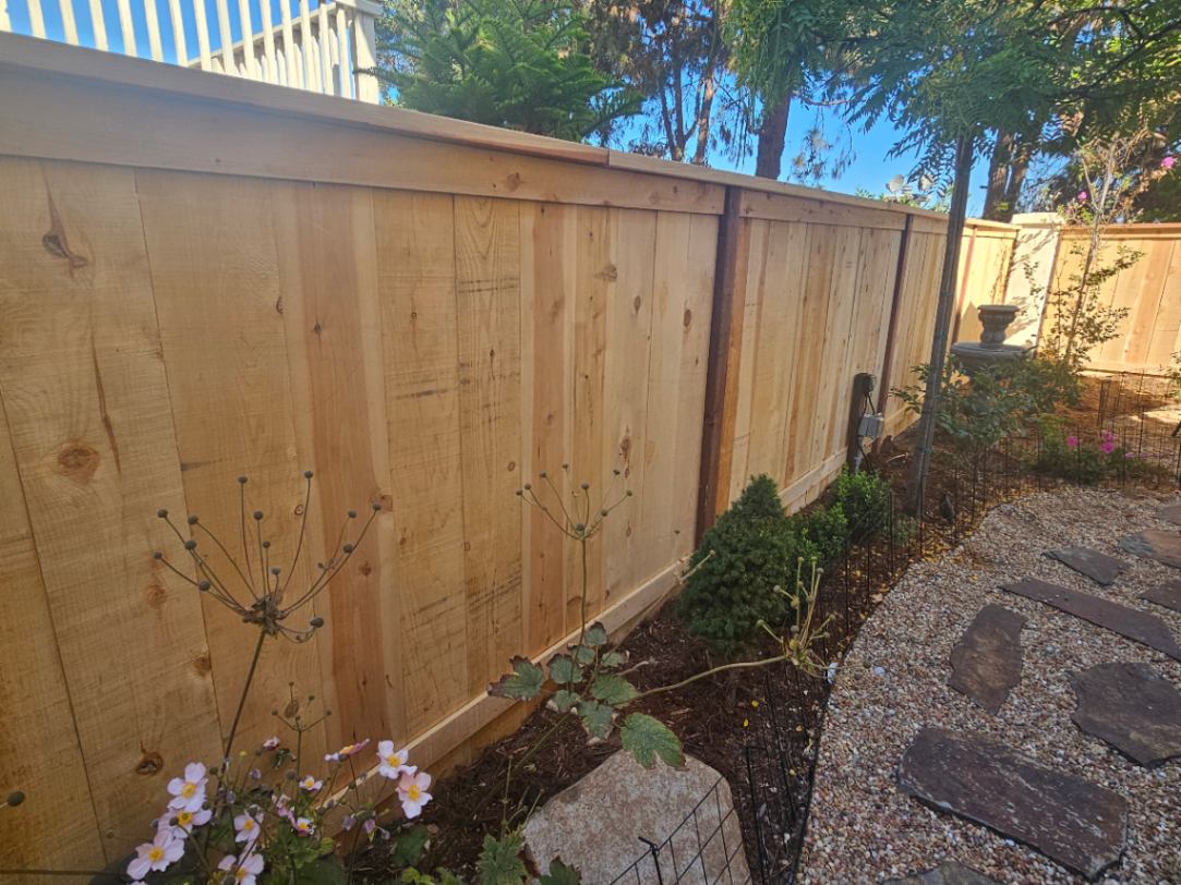 Standard Wood Fence Wooden fence post installation in Encinitas, CA.